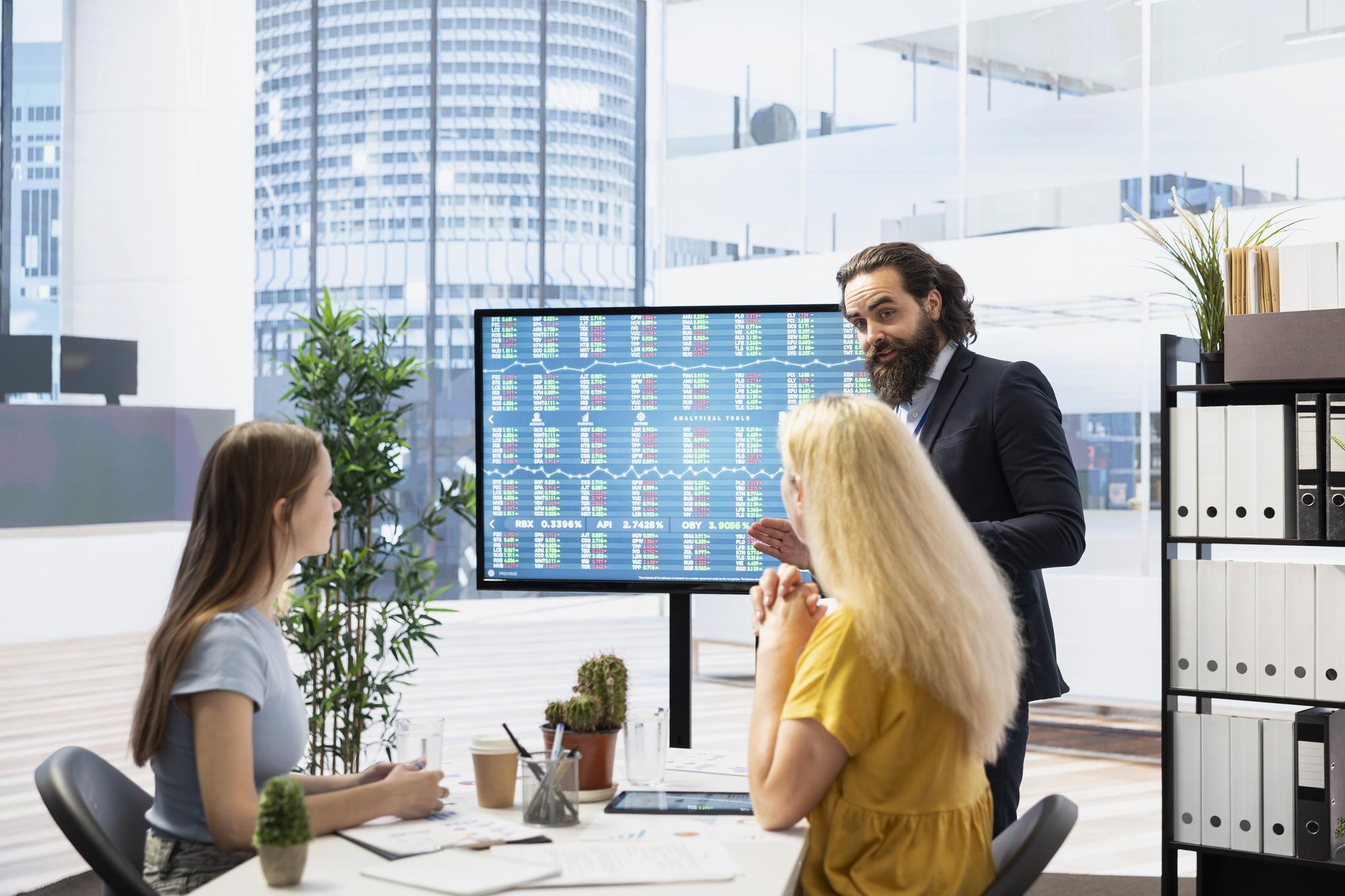 Team reviewing property analytics on screen