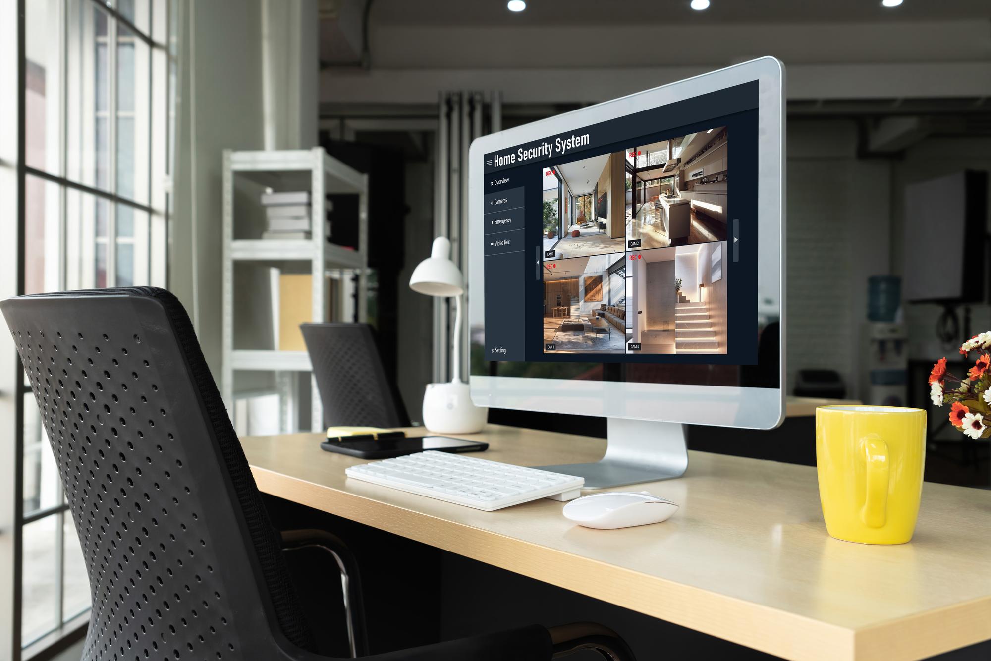 Office workspace with property listings on screen